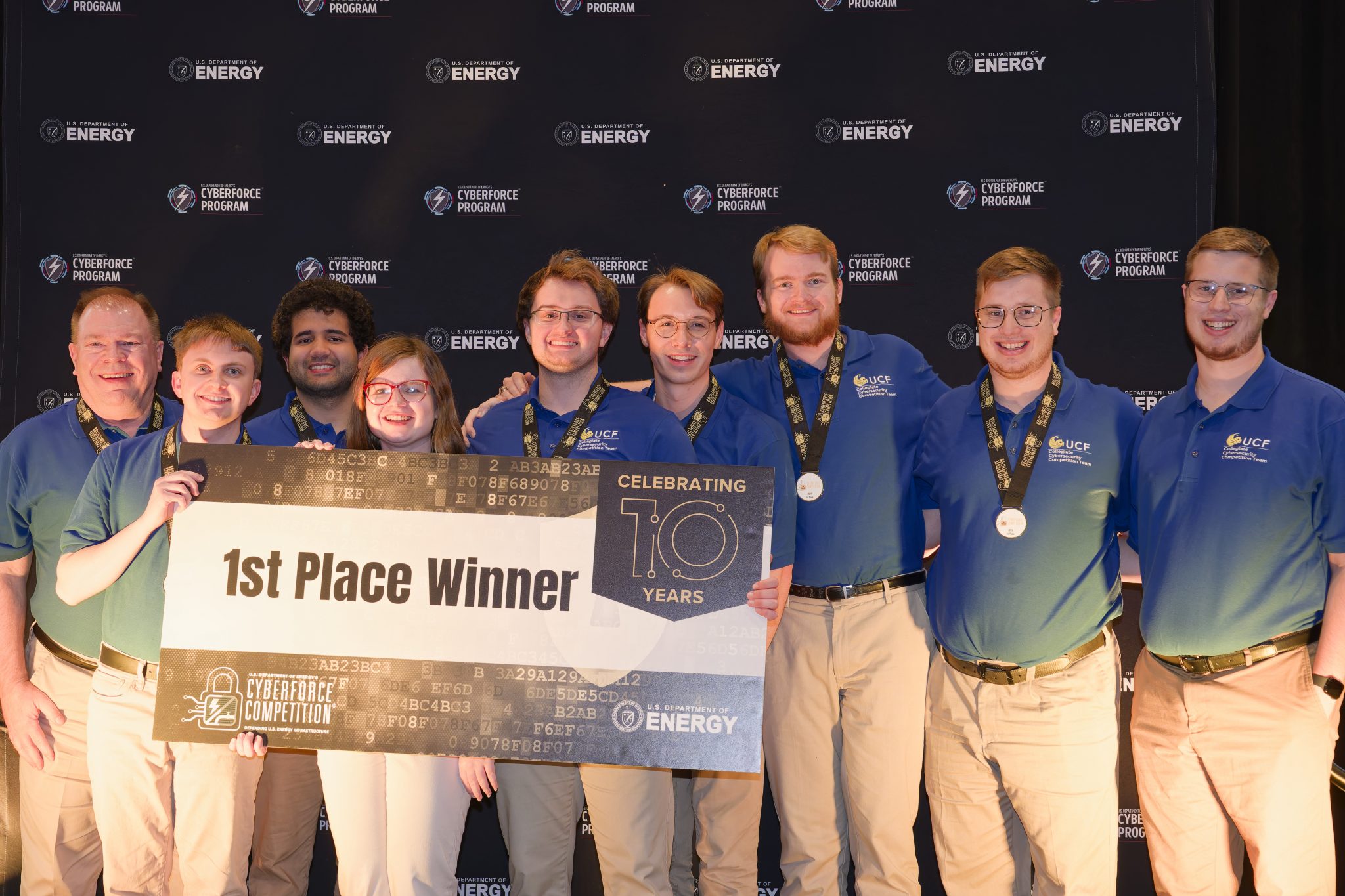 2024 CyberForce first place team stands on stage